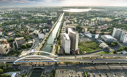 How does a large office development achieve gold level green building status?